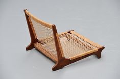 a wooden chair sitting on top of a white floor