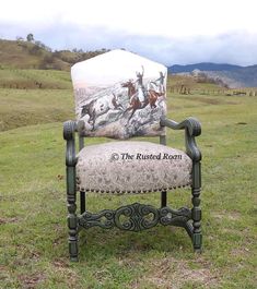 an old chair with a horse and rider on it in the middle of a field