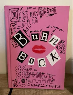 a pink book with black and white writing on the cover that says, rub n'book
