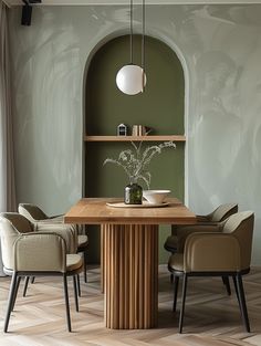 a dining room table with chairs around it and an arch in the wall behind it