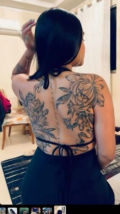 the back of a woman with tattoos on her body