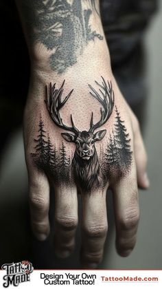 a man's hand with a deer tattoo on it