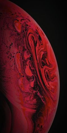 an abstract red and black background with swirls