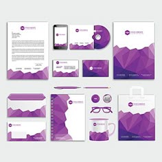 a set of stationery design with purple geometric shapes, including business cards and envelopes