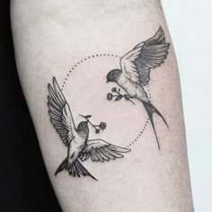 two birds flying next to each other with dots on their wings and one bird in the air