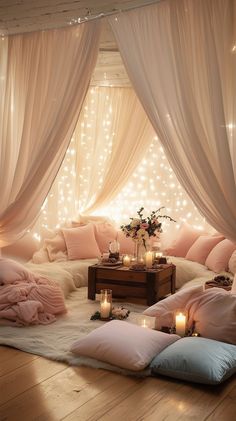 a living room filled with lots of pillows and lights