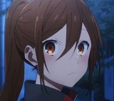an anime character with long brown hair and glowing eyes looking at something in the distance