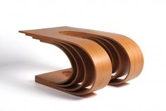 a wooden table with three curved sections on it