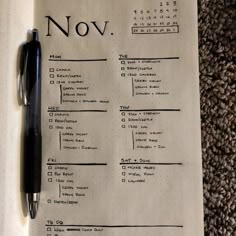 a notepad with a pen on top of it