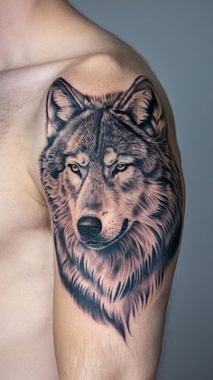 a man with a wolf tattoo on his arm
