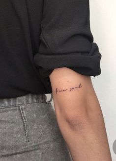 a person with a tattoo on their arm that says, i love you in cursive writing