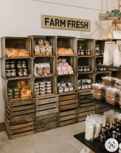 a store filled with lots of different types of food and drinks on wooden pallets