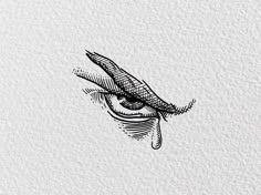 an eye drawn on top of a piece of paper