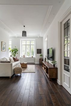15+ Stylish Wall Colors for Dark Brown Flooring in 2025 | Dark wood floors living room, Dark wood living room, Living room wood floor