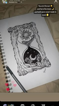 an open notebook with a drawing on it