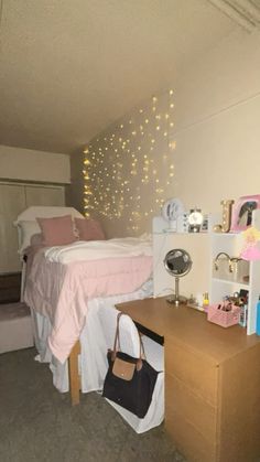 a bedroom with a bed, desk and shelves on the wall next to each other