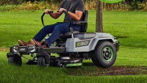 a man riding a lawn mower