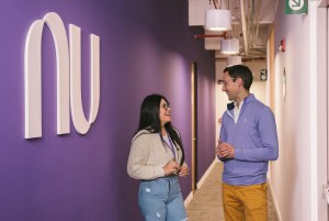 People talking at Nubank office in Colombia