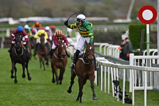 Jockey Paul Townend rides I Am Maximus past the finish line to win the Grand National Steeple Chase