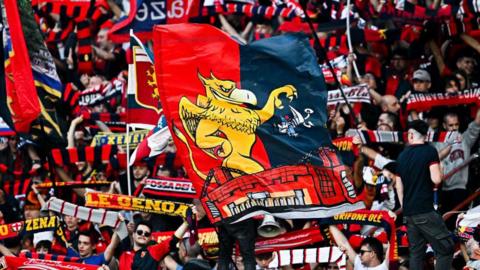 Genoa fans with flags and scarves