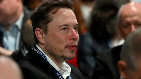 Elon Musk in the audience the AI Summit