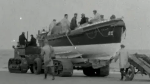 New launching carriage for lifeboats being tested at Wells-next-the-Sea in 1958.
