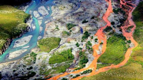 An aerial view of the rust-colored Kutuk River in Gates of the Arctic National Park in Alaska.