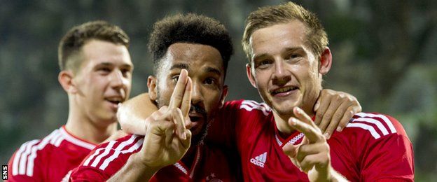Shay Logan (left) and Peter Pawlett celebrate after combining for Aberdeen's second goal