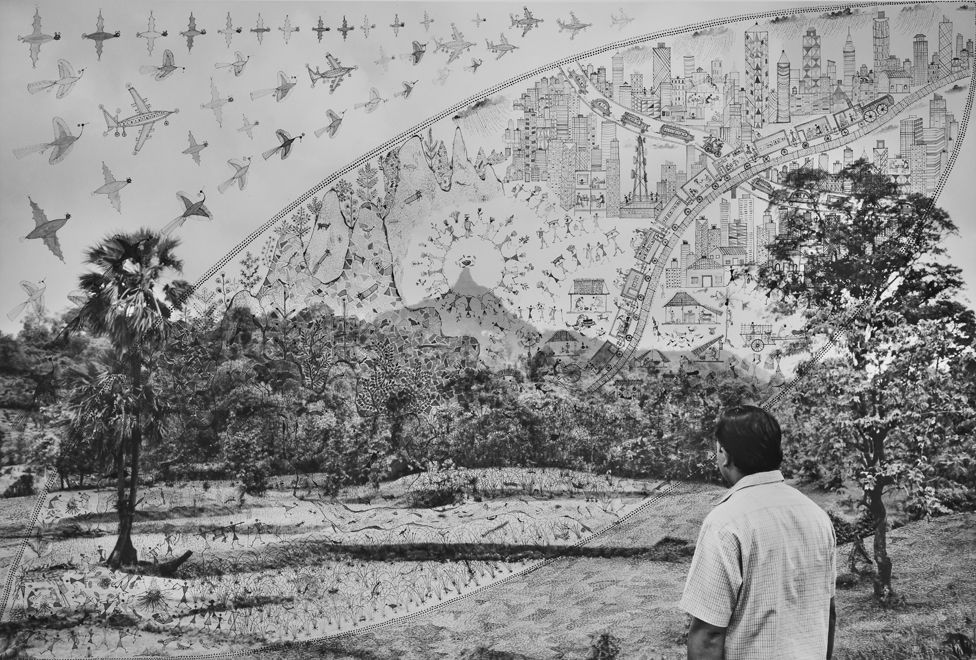 Black and white photograph of a person with their back turned, looking out to a forest, layered with Warli drawings over the image