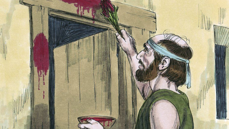 Jewish man painting doorpost with lamb's blood