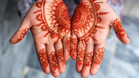 Girl displaying her Mehndi (henna) on occasion of Islamic festival of Eid-ul-Fitr