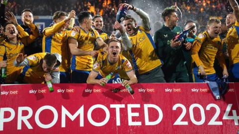 Mansfield Town players celebrate promotion