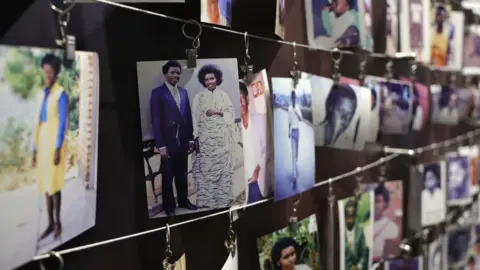 Photographs of the Rwandan genocide hang in a memorial museum