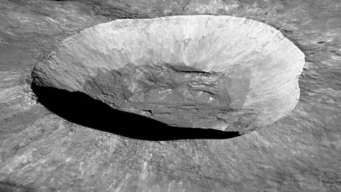 A photo of the Giordano Bruno lunar crater, taken in space on the Moon