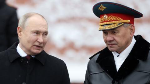 Russian President Vladimir Putin (L) and Sergei Shoigu