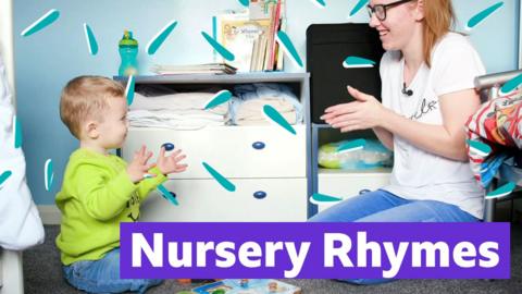 Woman playing with child 'Nursery Rhymes written below.