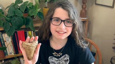 elana-holding-fossil-tooth.