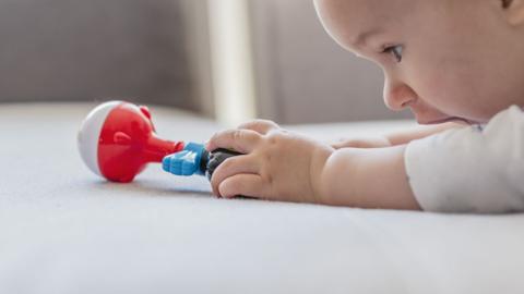 Baby playing with toy