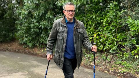 Michael Mosley walking with poles