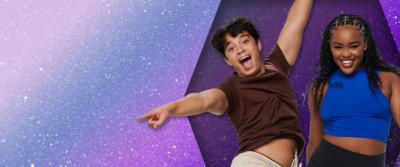 A young boy and girl are dancing in front of a purple glitter background