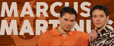 Marcus and Martinus, two young men with brown curly hair, they are brothers. On the left, he is wearing an orange shirt and on the right he is wearing a black and white zebra stripe shirt.