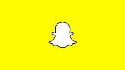 The white Snapchat logo on a yellow background
