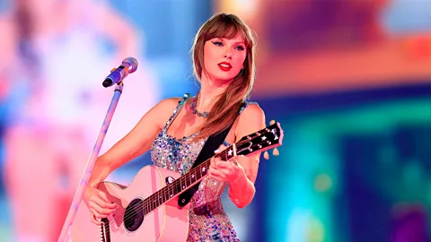 Taylor Swift performing (Credit: Getty)