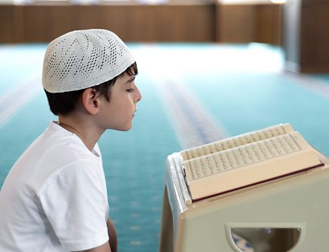 A child reading the Qur'an.