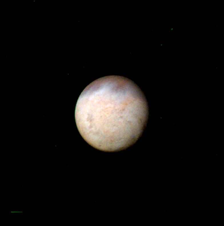 This image, taken by NASA Voyager 2 early in the morning of Aug. 23, 1989, is a false color image of Triton, Neptune largest satellite; mottling in the bright southern hemisphere is present.