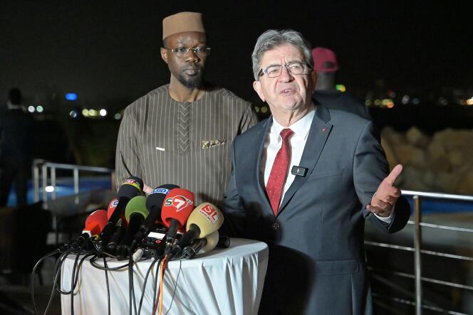 The founder of La France Insoumise (LFI) party Jean-Luc Mélenchon speaks alongside Senegalese Prime Minister Ousmane Sonko during a press conference at a hotel in Dakar on May 15, 2024.