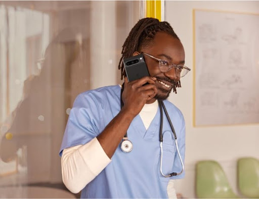 A doctor taking a call on his Pixel phone.