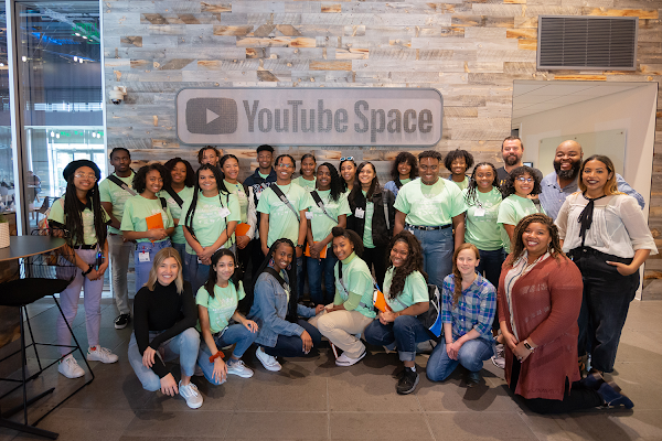 NAACP Afro-Academic, Cultural Technological and Scientific Olympics (ACT-SO) participants pose in front of a YouTube Space sign while touring Google offices.