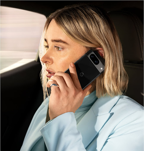 A woman talking on her Google Pixel 8 phone.
