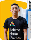 Smiling man looking into camera wearing tee: 'Ask me about Anthos'